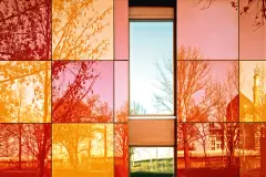 StoVentec Glass Rainscreen Cladding System, Bright red orange and yellow glass Radiance reflections reflective shiny Smooth
