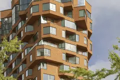 Residential tower of the ‘De Puls’ building complex with brick-look facade