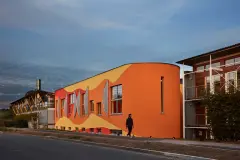 vivid colours, SIr Peter Cook, bright orange, deep red, luminous yellow, coloured render, coloured facade, coloured stucco, coloured plaster, colour in architecture, bright colours