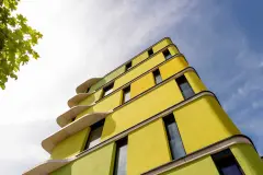 coloured render, coloured facade, coloured insulated facade, bright, vivid, luminous colours, bright yellow, radiant green