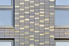 Close-up of facade surface: grey StoCera ceramic facade of the Sportlerhaus in Hamburg