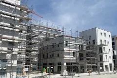 Scaffolded Rivus Vivere neighbourhood, brick slips cladding on EWIS from Sto