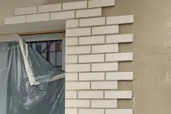 Laying StoBrick brick slips on the facade of the Rivus Vivere urban neighbourhood