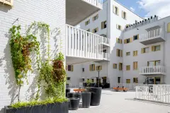 Rivus Vivere urban neighbourhood, white StoBrick facades with greenery